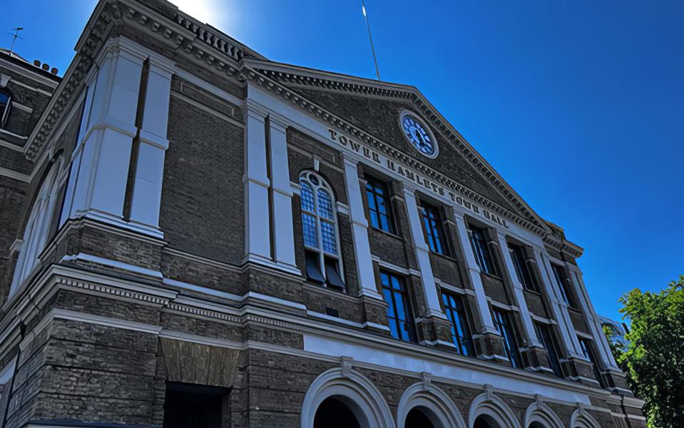 Photograph of the Town Hall at Whitechapel from a few meters away, looking up and across at the frontage