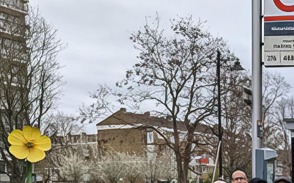 Photo of a group of rubbish collecting volunteers in high viz vests, in front of a bus stop